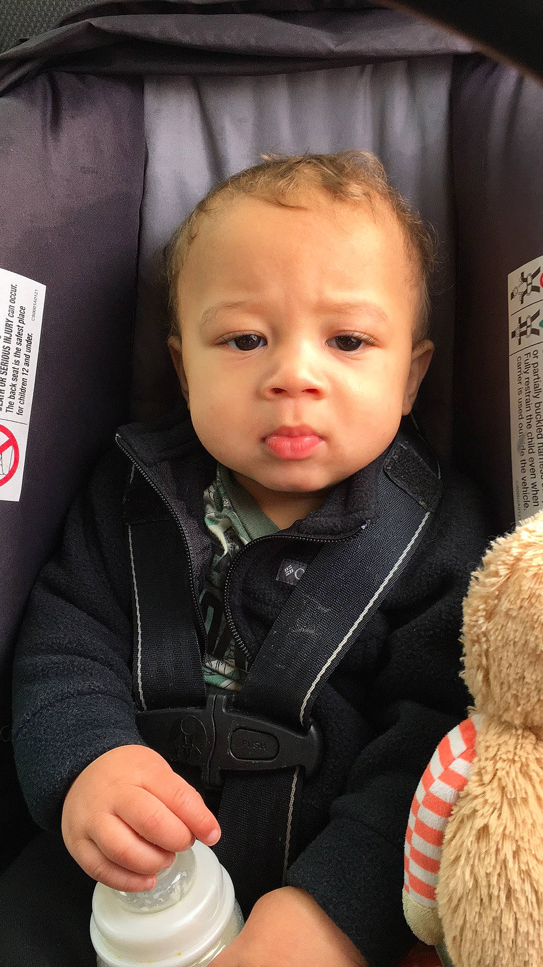 Kaius is registered to the contest to win money with this photo: baby, baby_toddler_clothing, beauty, car_seat, cheek, child, comfort, facial_expression, finger, gesture, happy, human, jacket, nose, person, product, sitting, skin, sleeve, thumb