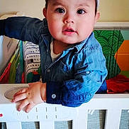 Melbin Alexander joined the competition — help win amazing prizes! baby, cap, child, clothing, colorful, crib, curious, denim_shirt, expression, face, furniture, hand, home, indoor, infant, person, playroom, portrait, room, young_child