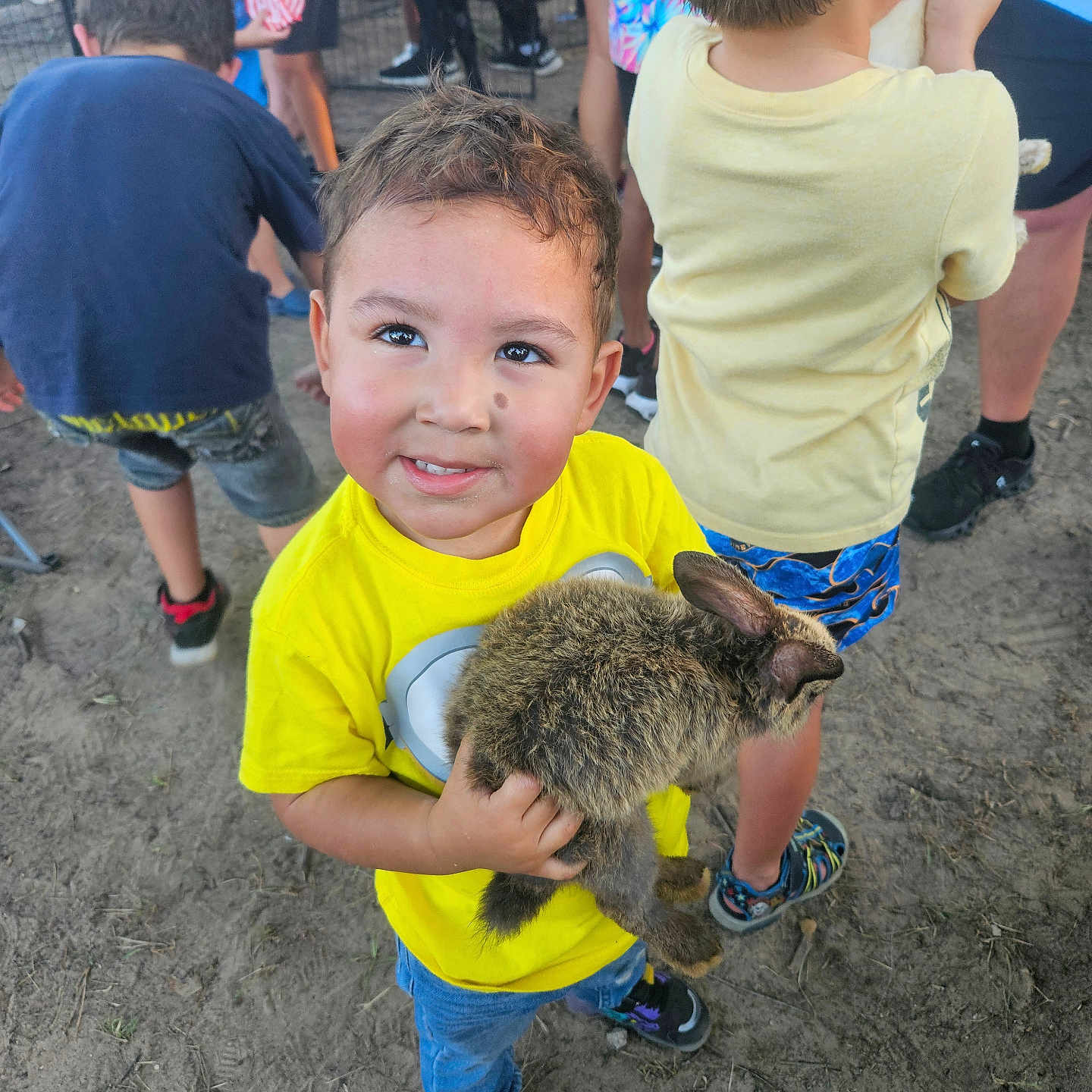 Diego Alessandro joined the competition — help win amazing prizes! animal, boy, bunny, casual_clothing, child, crowd, cute, dirt_ground, family, festival, fun, happy, outdoor, people, pet, shorts, smiling, sneakers, summer, yellow_shirt