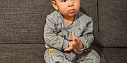 Diego Alessandro is registered to the contest to win money with this photo: baby, bodypart, clothing, couch, cushion, face, finger, formalwear, furniture, hand, head, homedecor, jeans, pajamas, pants, person, photography, portrait, sitting, suit