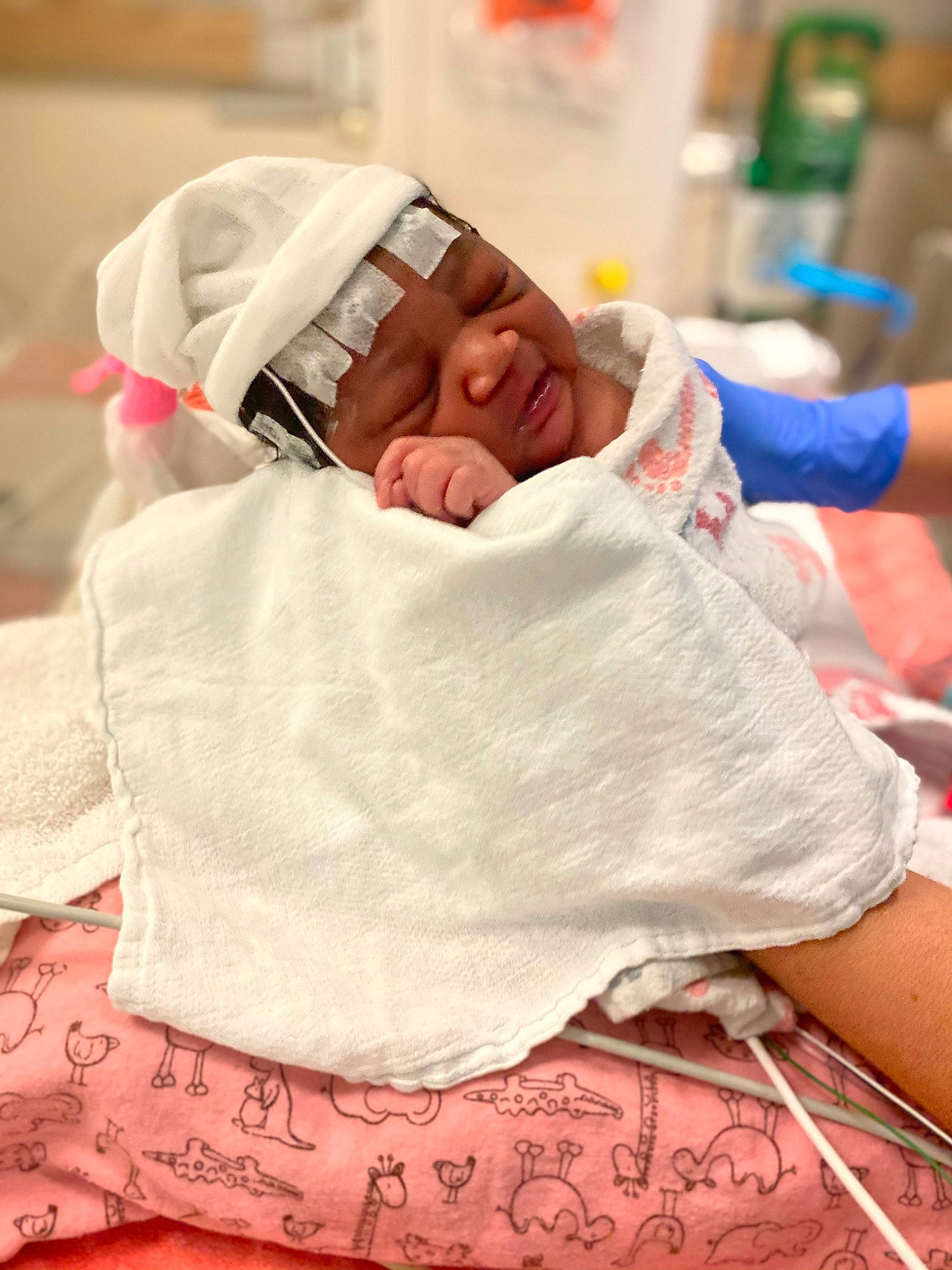 Brielle joined the competition — help win amazing prizes! baby, baby_sleeping, bed, bedtime, child, comfort, event, headwear, health_care, hospital, hospital_bed, linens, magenta, medical, nap, patient, person, service, sleeve, t_shirt