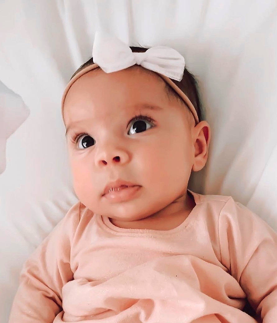 Amarah joined the competition — help win amazing prizes! baby, baby_making_funny_faces, cheek, child, chin, ear, face, fashion_accessory, hair_accessory, head, headband, headgear, lip, nose, person, pink, portrait_photography, skin, toddler
