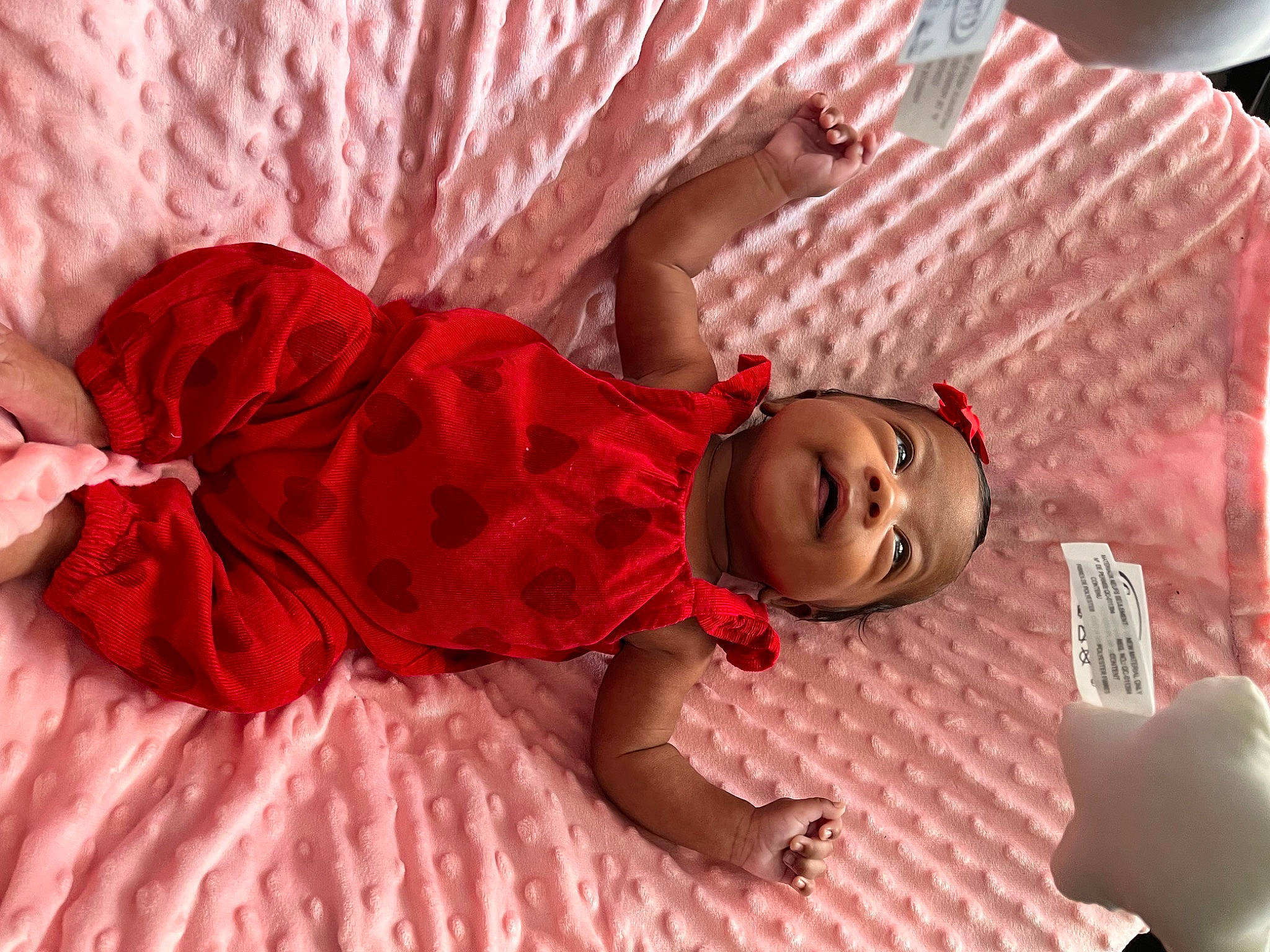 Maziah Johnson joined the competition — help win amazing prizes! baby, baby_toddler_clothing, child, comfort, doll, fashion_accessory, flooring, fun, happy, linens, magenta, pattern, person, pink, purple, room, sitting, skin, textile, toddler