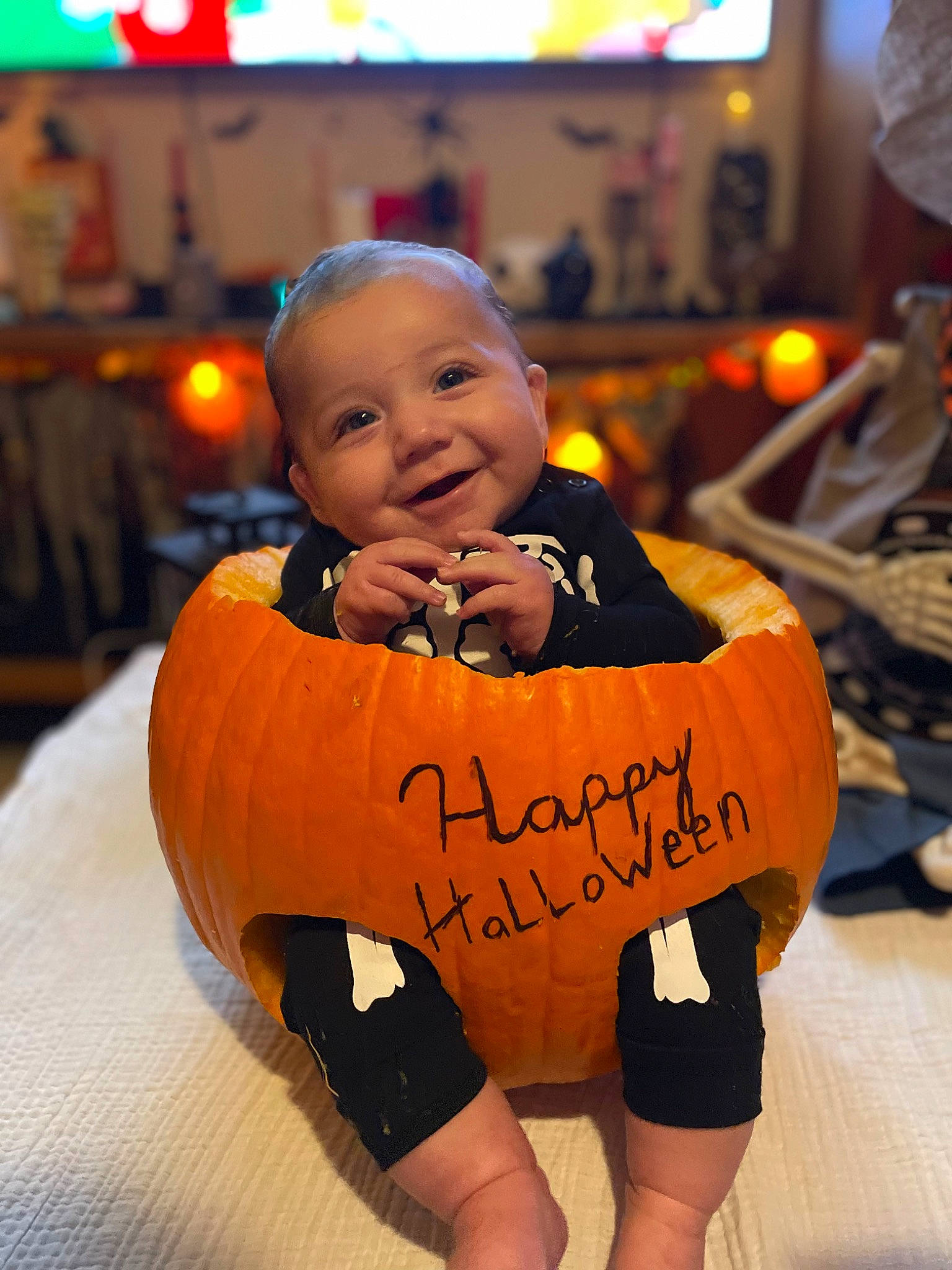 Ivan is registered to the contest to win money with this photo: baby, baby_toddler_clothing, chair, cheek, child, dress, event, flooring, font, formal_wear, fun, happy, human_leg, joy, leisure, orange, person, room, sitting, smile