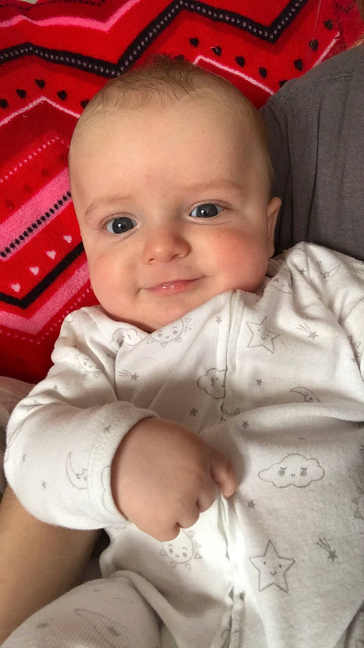 Levi is registered to the contest to win money with this photo: baby, cheek, child, chin, eye, face, forehead, head, iris, lip, mouth, nose, person, sitting, skin, smile, toddler