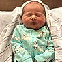 Ryker joined the competition — help win amazing prizes! newborn, baby, sleeping, blanket, onesie, clothing, infant, cute, peaceful, wrapped, soft, portrait, child, face, hand, resting, indoors, fabric, pattern, cozy