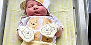 Ryker joined the competition — help win amazing prizes! newborn, baby, sleeping, hospital, bassinet, yellow_blanket, winnie_the_pooh, hat, mittens, pants, socks, infant, cute, cozy, child, person, rest, soft, clothing, indoor