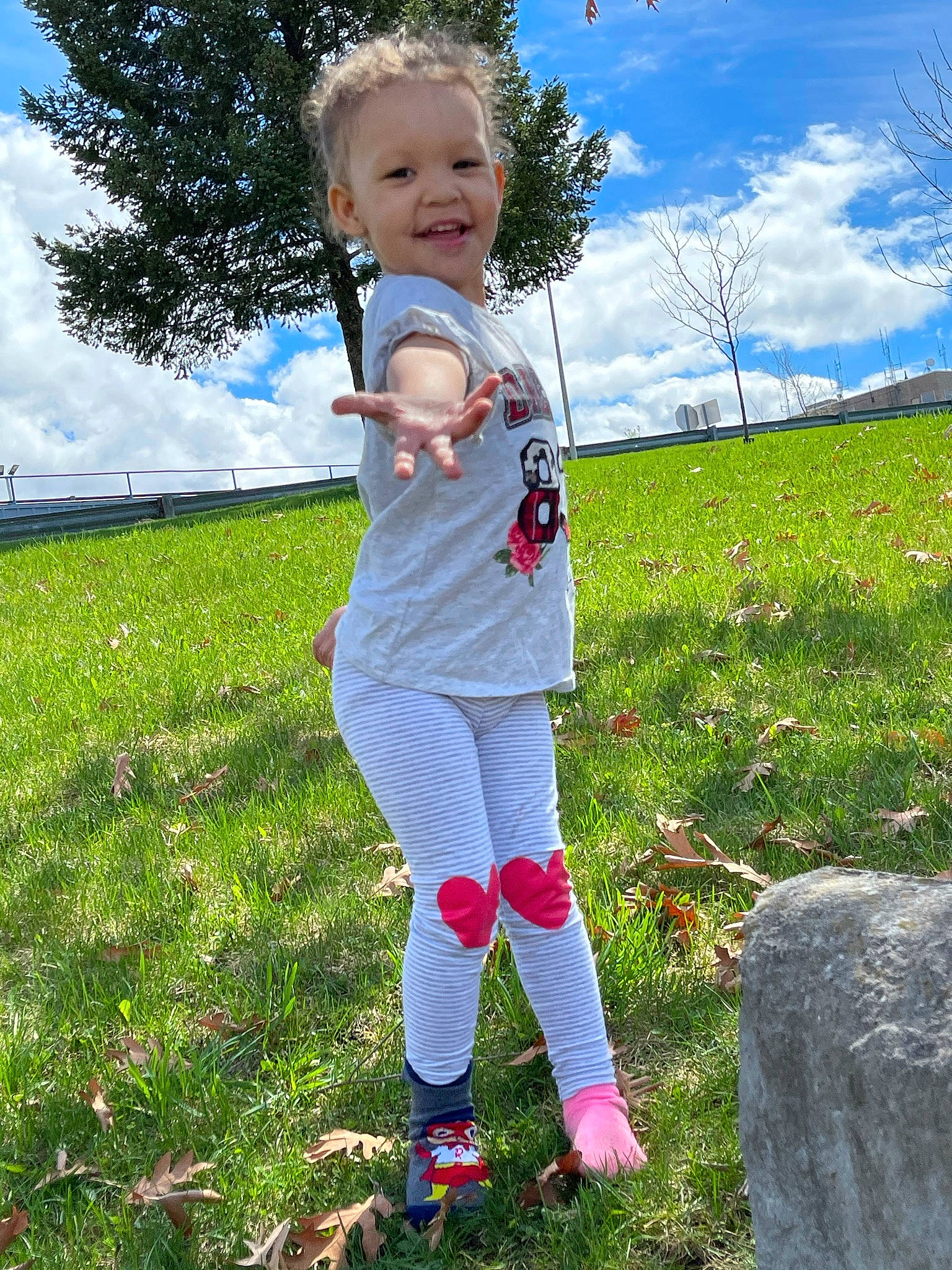 Alayna Ema joined the competition — help win amazing prizes! baby_toddler_clothing, child, cloud, electric_blue, fun, grass, grassland, green, happy, joy, lawn, leisure, meadow, people_in_nature, person, plant, sky, smile, sneakers, standing