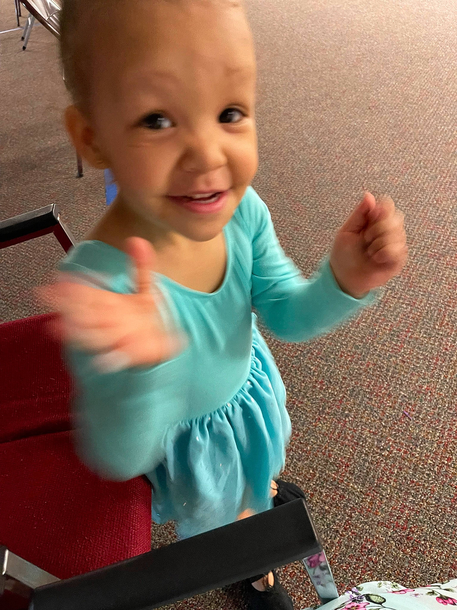 Alayna Ema is registered to the contest to win money with this photo: arm, baby, baby_toddler_clothing, elbow, face, finger, gesture, hand, happy, joint, joy, muscle, organ, person, shoulder, skin, sleeve, smile, standing, t_shirt