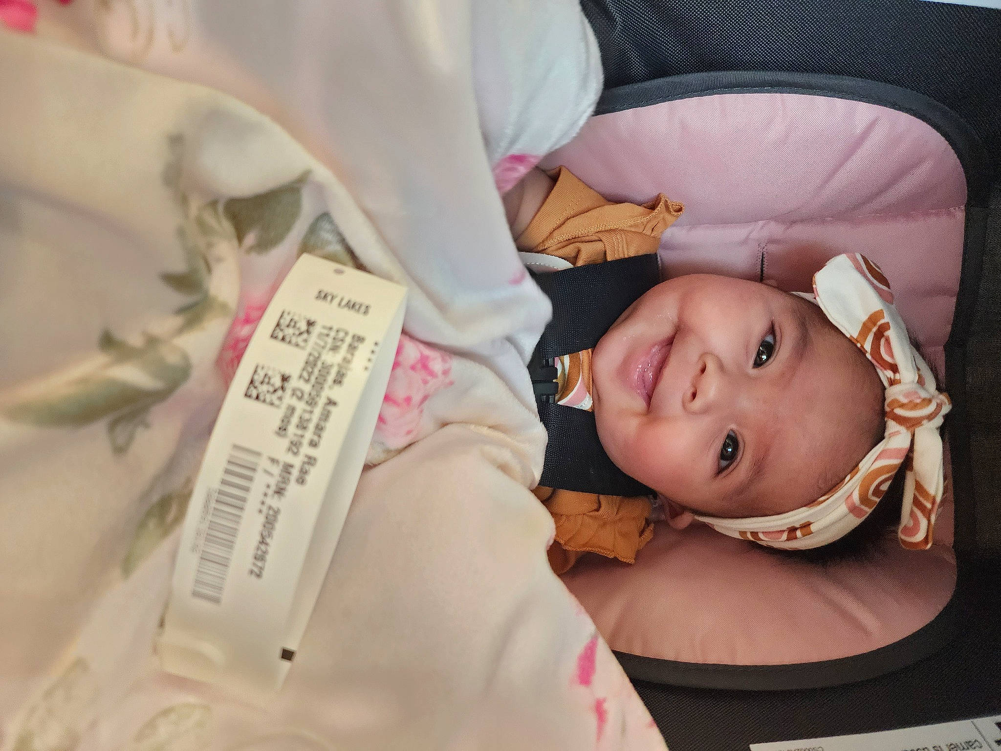 Amara is registered to the contest to win money with this photo: baby, baby_products, baby_toddler_clothing, cheek, child, comfort, eyebrow, eyelash, happy, headwear, joy, person, pink, room, skin, sleeve, smile, textile, toddler