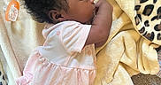 Honesti is registered to the contest to win money with this photo: baby, sleeping, blanket, pacifier, pink_dress, curly_hair, infant, soft_texture, carpet, leopard_print, cuteness, nursery, cozy, foot, child, resting, indoors, toddler, peaceful, clothing
