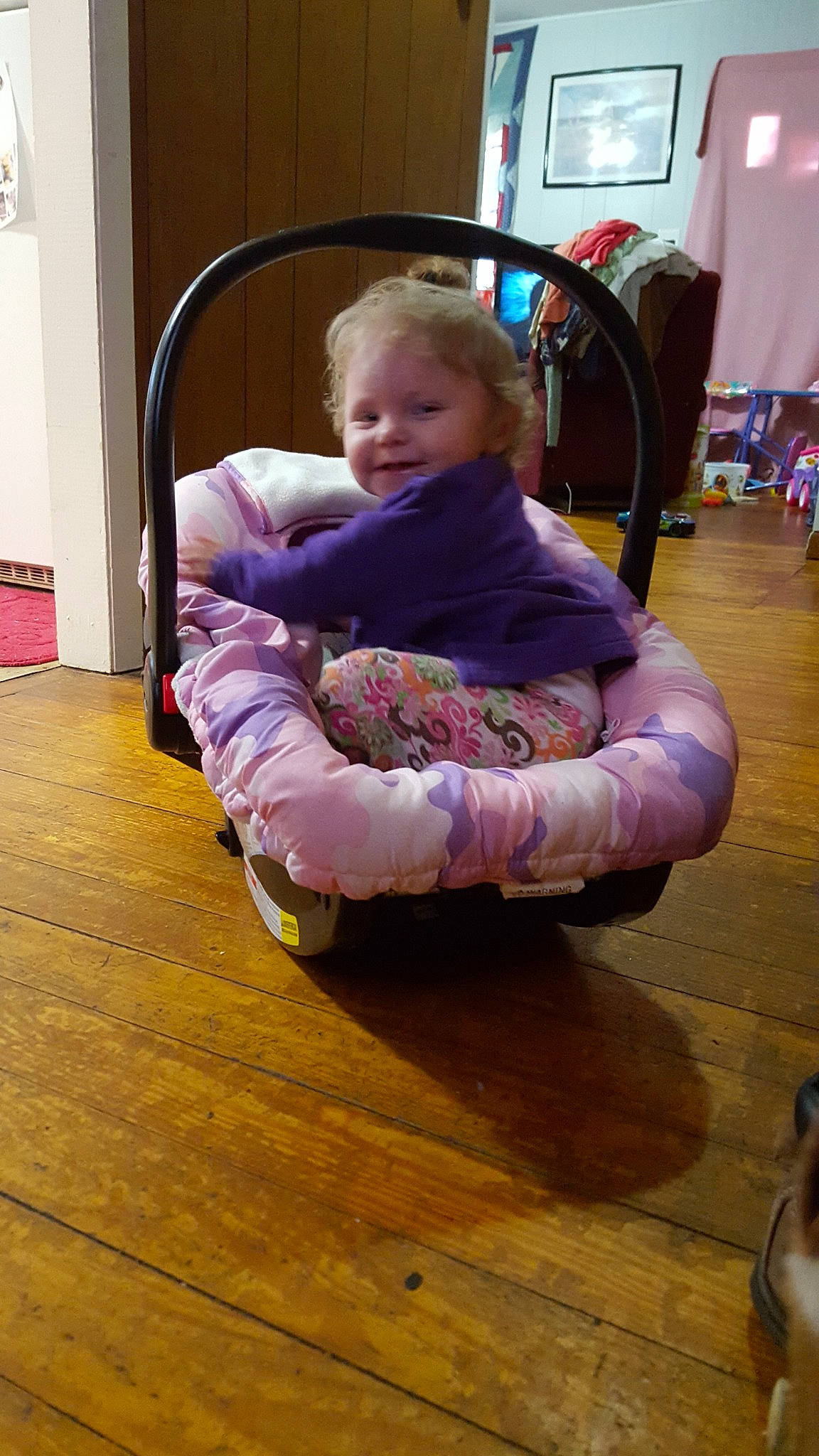 Angelika joined the competition — help win amazing prizes! chair, child, day, floor, flooring, fun, furniture, girl, hardwood, infant, leg, person, play, product, purple, sitting, skin, toddler