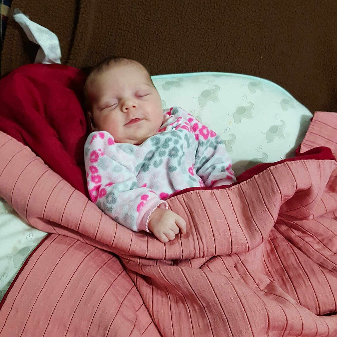 Sheila is registered to the contest to win money with this photo: baby_products, bed, bedtime, child, day, eye, fun, girl, infant, nap, person, pink, product, sitting, skin, sleep, textile, toddler