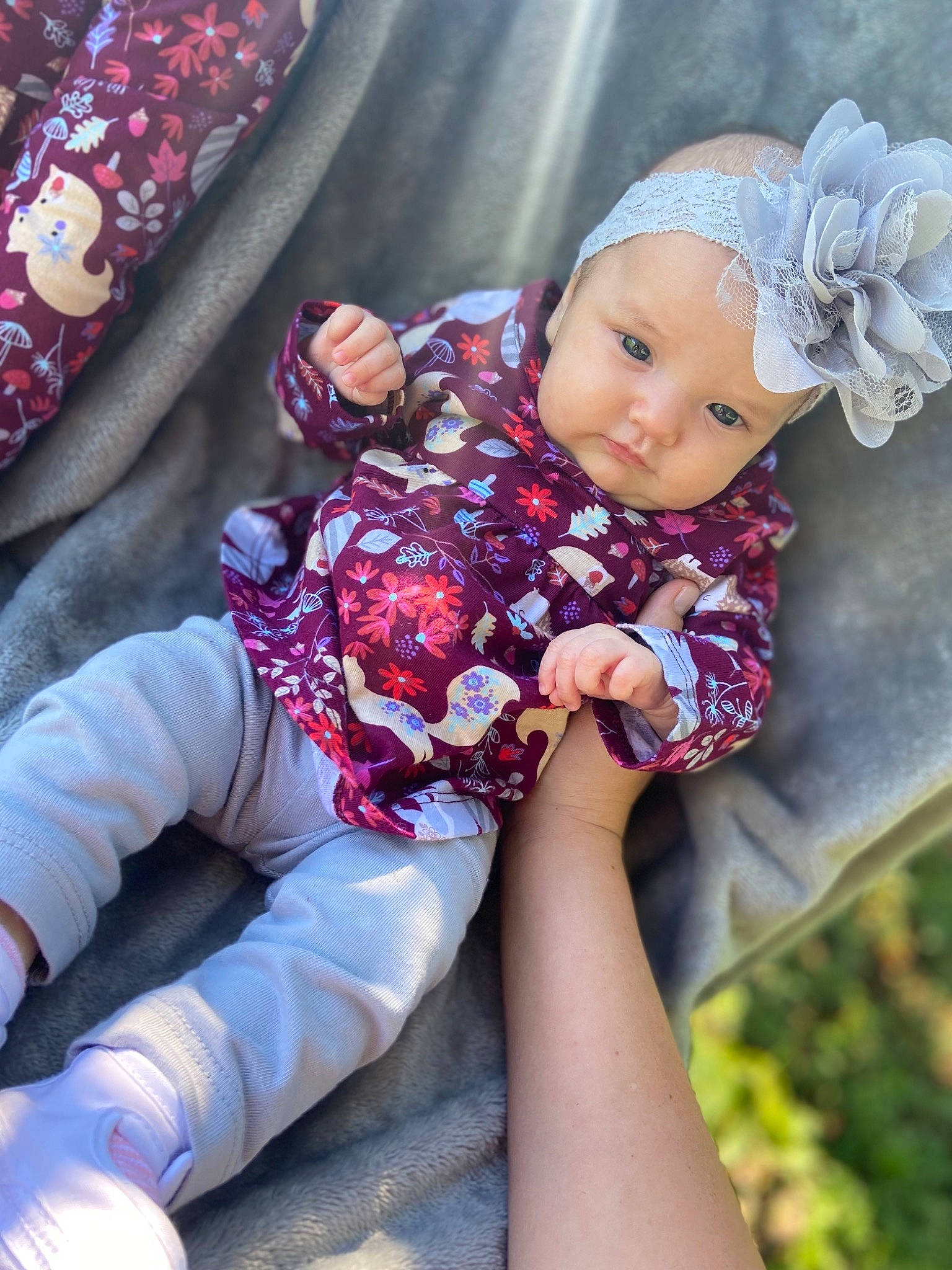 Emerie joined the competition — help win amazing prizes! arm, baby, baby_toddler_clothing, beauty, cool, grass, happy, headwear, lip, magenta, pattern, person, pink, plant, purple, sitting, sleeve, smile, textile, thigh