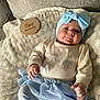baby, infant, two_months, headband, bow, blanket, couch, onesie, tutu, skirt, hand, face, cheeks, eyes, portrait, indoors, soft_light, milestone_disk, cute, smiling