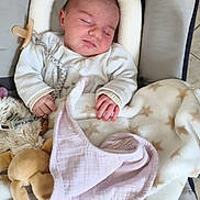 Nina participe au concours pour gagner de l'argent avec cette photo : baby, blanket, child, clothing, comfort, cushion, cute, fabric, hand, head, indoors, infant, nap, pacifier, peaceful, plush_toy, resting, seat, sleeping, soft_toys