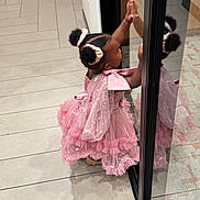 Alia joined the competition — help win amazing prizes! adorable, black_hair, child, curious, cute, fashion, girl, glass_door, hair_scrunchies, hands_on_glass, indoor, little_girl, pink_dress, puffed_sleeves, reflection, ruffles, side_view, standing, tile_floor, young_child