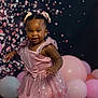 Alia is registered to the contest to win money with this photo: toddler, child, girl, pink_dress, hair_bows, balloons, party, celebration, smiling, standing, sparkles, bokeh, happy, portrait, cute, indoors, fashion, festive, young_child, person