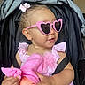toddler, child, sunglasses, pink, doll, stroller, toy, baby, clothing, accessory, cute, portrait, indoor, seatbelt, hair_bow, smile, face, hand, person, fashion