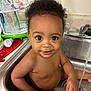 Arys joined the competition — help win amazing prizes! baby, bath, bottles, child, cleaning, curly_hair, cute, eyes, face, faucet, happy, indoors, kitchen, person, playful, sink, skin, smile, toddler, water