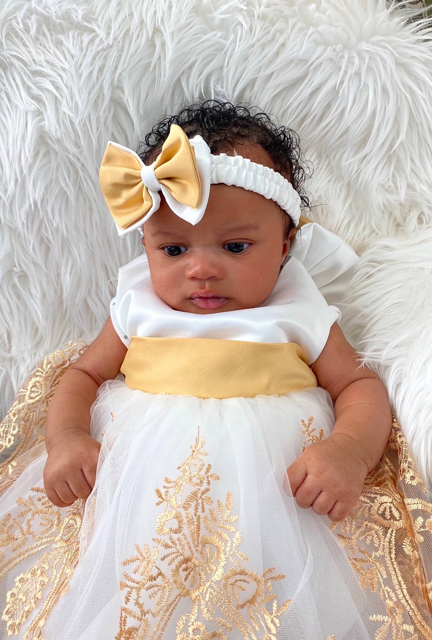 Kimora is registered to the contest to win money with this photo: baby, baby_toddler_clothing, beauty, bridal_accessory, bridal_clothing, child, dress, embellishment, event, face, happy, head, headgear, headpiece, headwear, person, pink, skin, sleeve, toddler