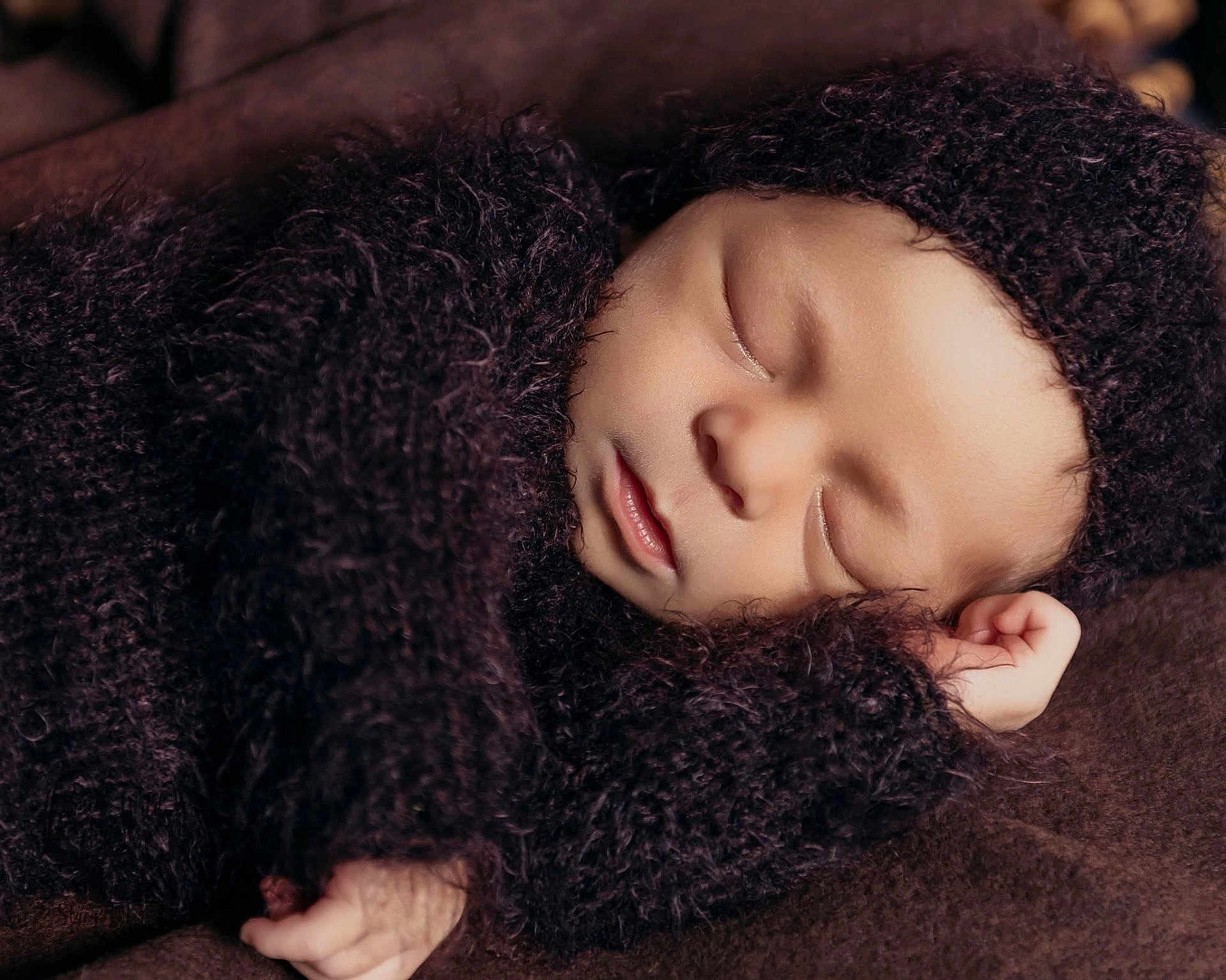 Oakland joined the competition — help win amazing prizes! baby, newborn, sleeping, knitted_clothing, brown, cozy, infant, soft_texture, portrait, cute, peaceful, child, closeup, resting, wrapped, warm, tiny_hand, headwear, sleep, blanket