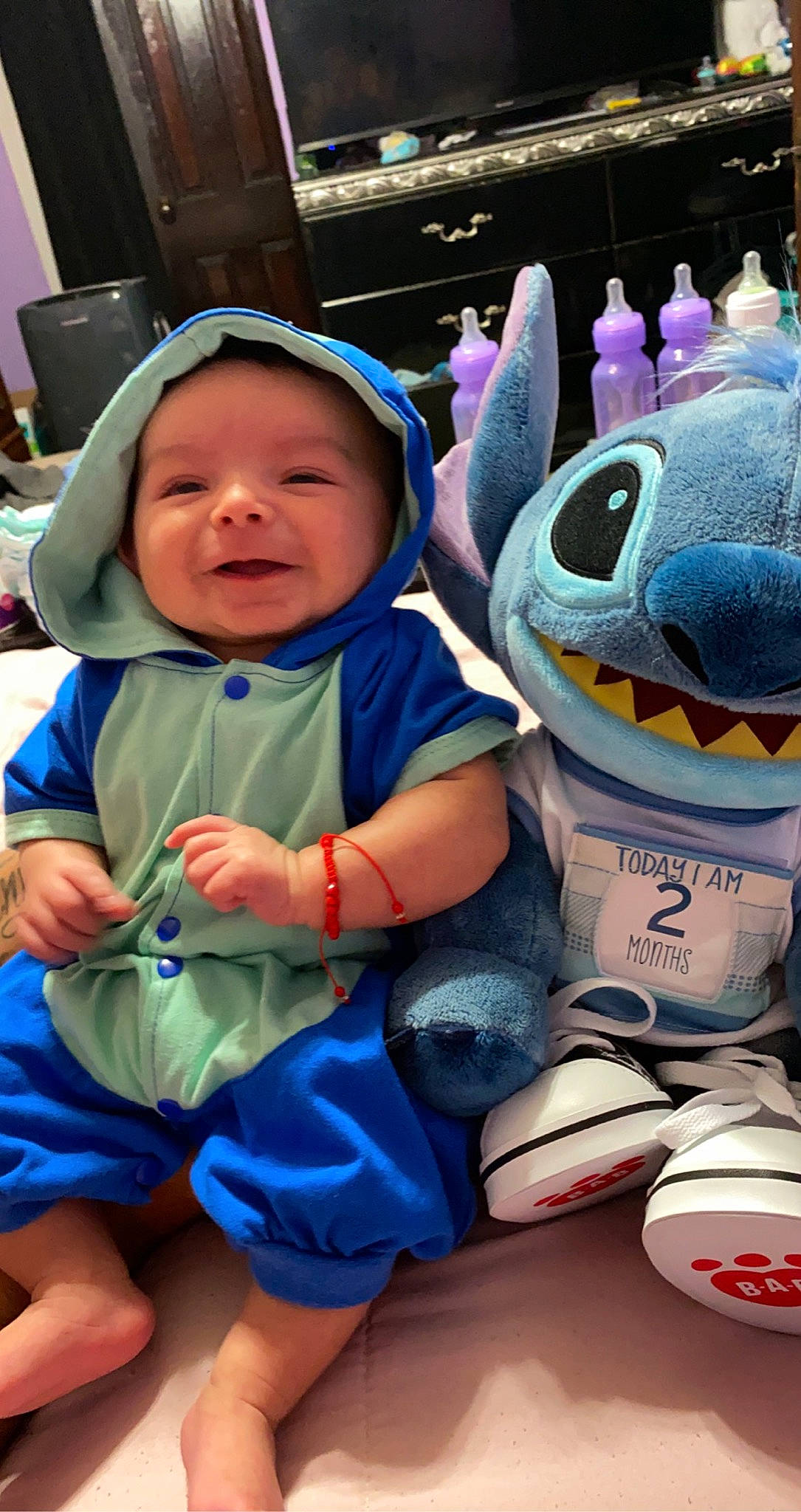 Leonardo is registered to the contest to win money with this photo: azure, baby, baby_toddler_clothing, baseball_cap, cap, child, electric_blue, event, fun, happy, headwear, leisure, mouth, person, personal_protective_equipment, purple, smile, snapshot, toddler, toy