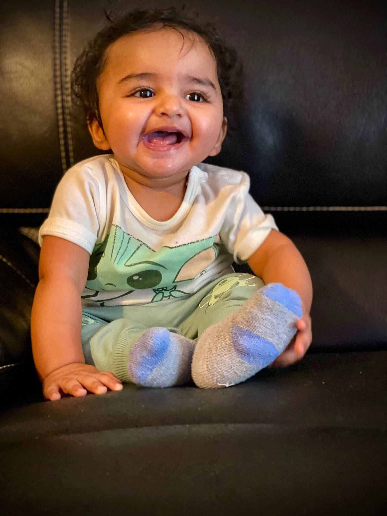 Dhanush is registered to the contest to win money with this photo: arm, baby, baby_toddler_clothing, cheek, child, comfort, face, finger, flash_photography, fun, gesture, hand, happy, mouth, nose, person, skin, sleeve, smile, t_shirt