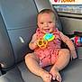 Kolson is registered to the contest to win money with this photo: baby, child, smiling, toy, car_seat, car_interior, dunkin_box, water_bottle, happy, cute, infant, clothing, seat, sitting, portrait, human, skin, face, hand, foot