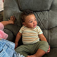 Rome joined the competition — help win amazing prizes! toddler, child, curly_hair, striped_shirt, green_pants, chair, upholstery, indoor, hand, skin, casual_clothing, sitting, cute, expression, person, plush_furniture, relaxed, young_child, comfort, family