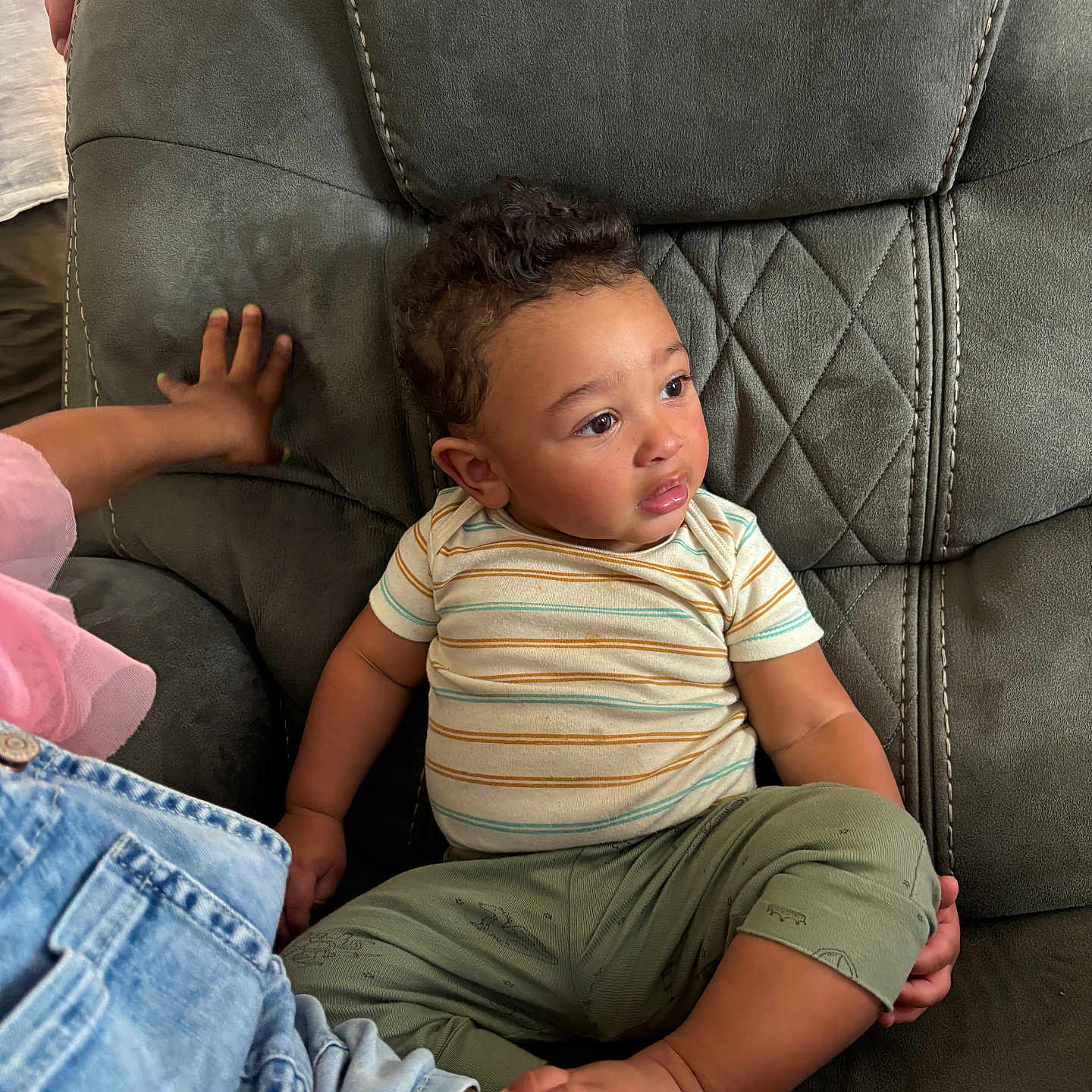 Rome joined the competition — help win amazing prizes! toddler, child, curly_hair, striped_shirt, green_pants, chair, upholstery, indoor, hand, skin, casual_clothing, sitting, cute, expression, person, plush_furniture, relaxed, young_child, comfort, family