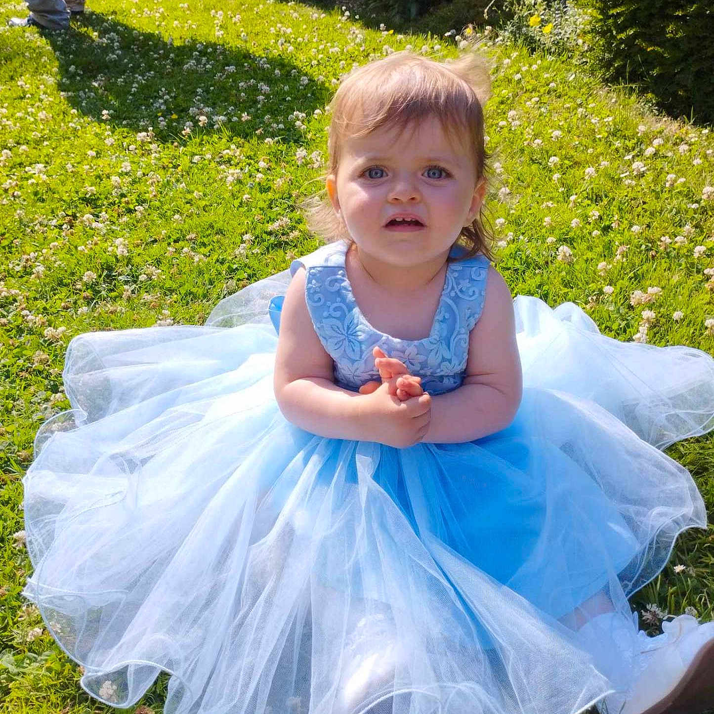 Inaya participe au concours pour gagner de l'argent avec cette photo : backyard, child, clothing, costume, dress, face, fashion, formalwear, gown, grass, head, lawn, nature, outdoors, person, photography, plant, portrait, sitting, yard