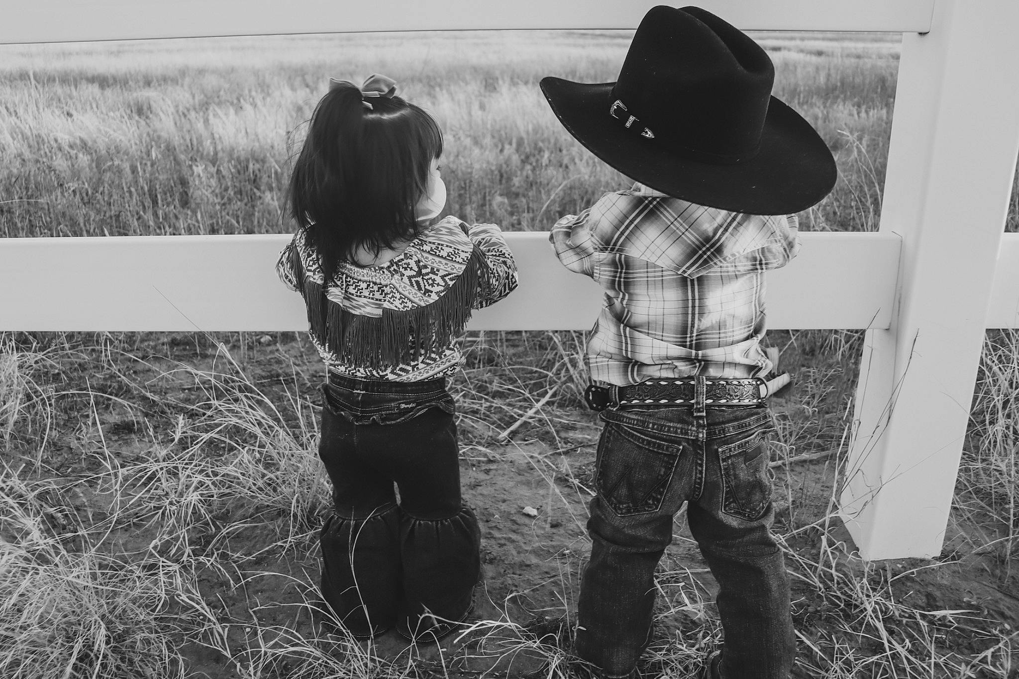 Elani joined the competition — help win amazing prizes! agriculture, black_and_white, cowboy_hat, event, gesture, grass, grassland, happy, hat, headgear, landscape, monochrome, monochrome_photography, people_in_nature, person, prairie, rural_area, standing, style, sun_hat