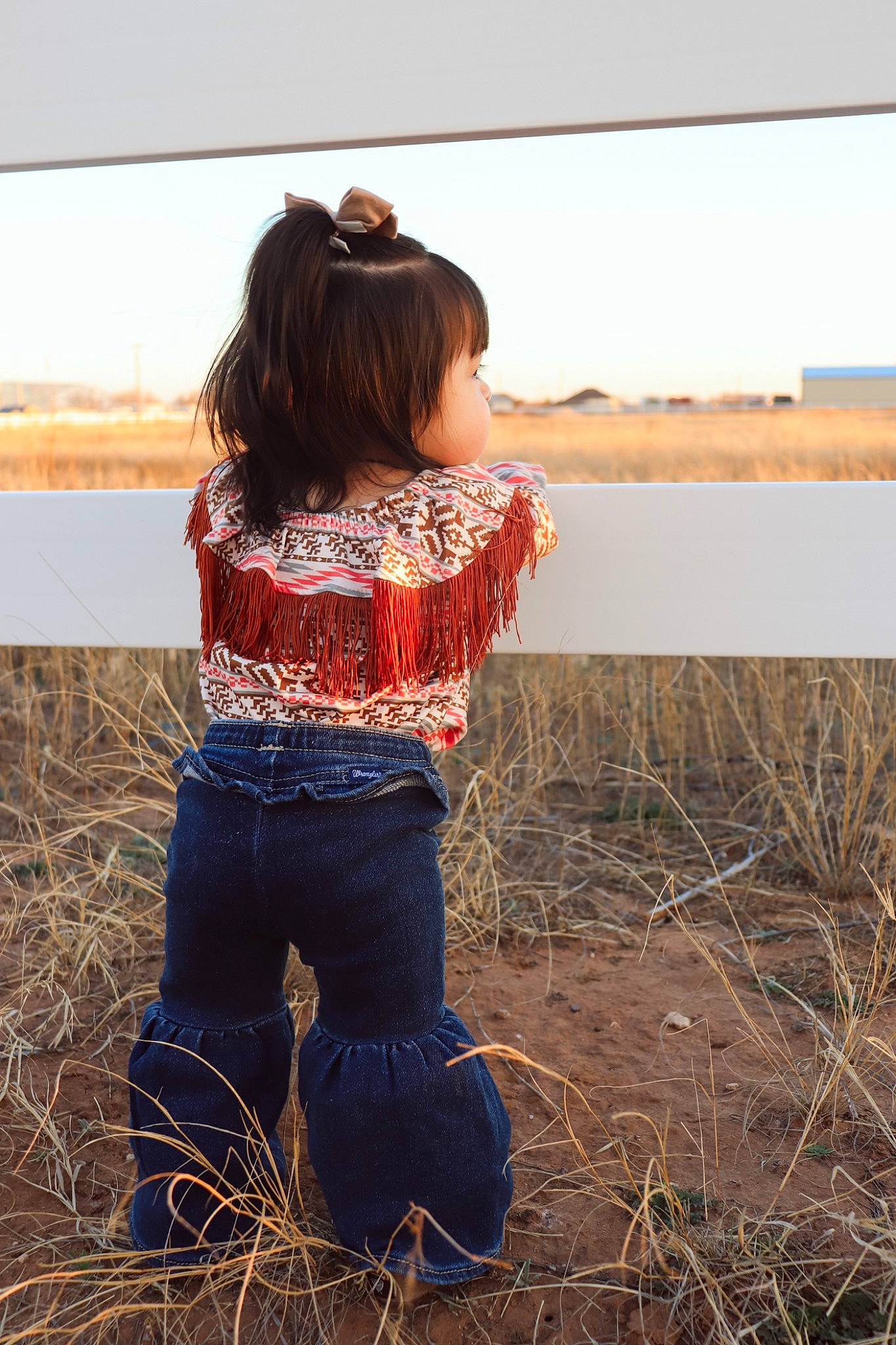 Elani joined the competition — help win amazing prizes! agriculture, blond, brown_hair, denim, field, grass, grassland, happy, hay, human_leg, jeans, landscape, long_hair, people_in_nature, person, prairie, sitting, sky, soil, sunlight