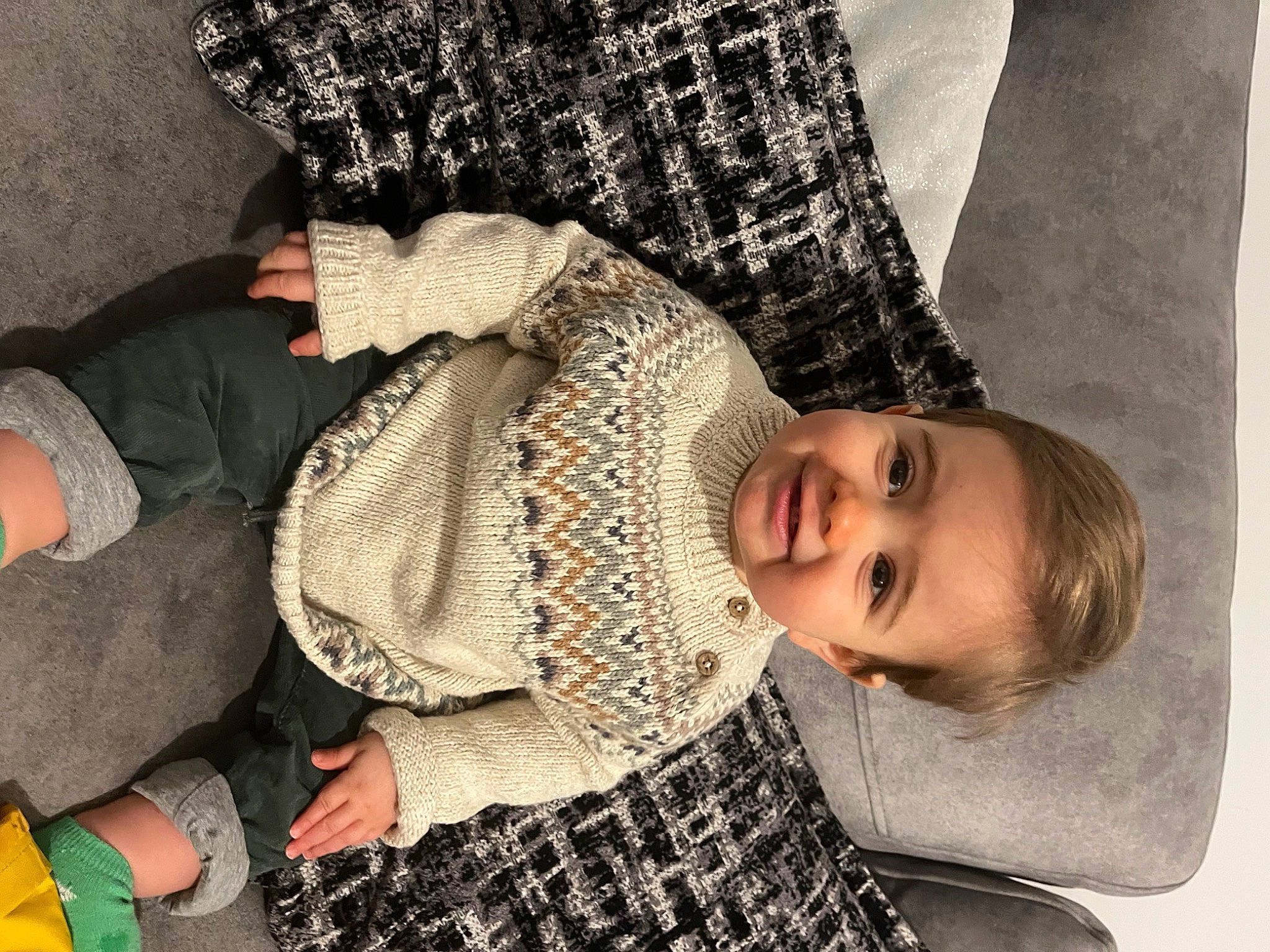 Archi is registered to the contest to win money with this photo: baby_toddler_clothing, black, child, comfort, design, fun, gesture, happy, interaction, joint, joy, mammal, pattern, person, photograph, sitting, sleeve, smile, textile, toddler