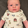 baby, infant, child, onesie, mittens, couch, face, blue_eyes, farm_animals, barn, tractor, pants, clothing, indoor, portrait, young_child, cute, expression, person, seated