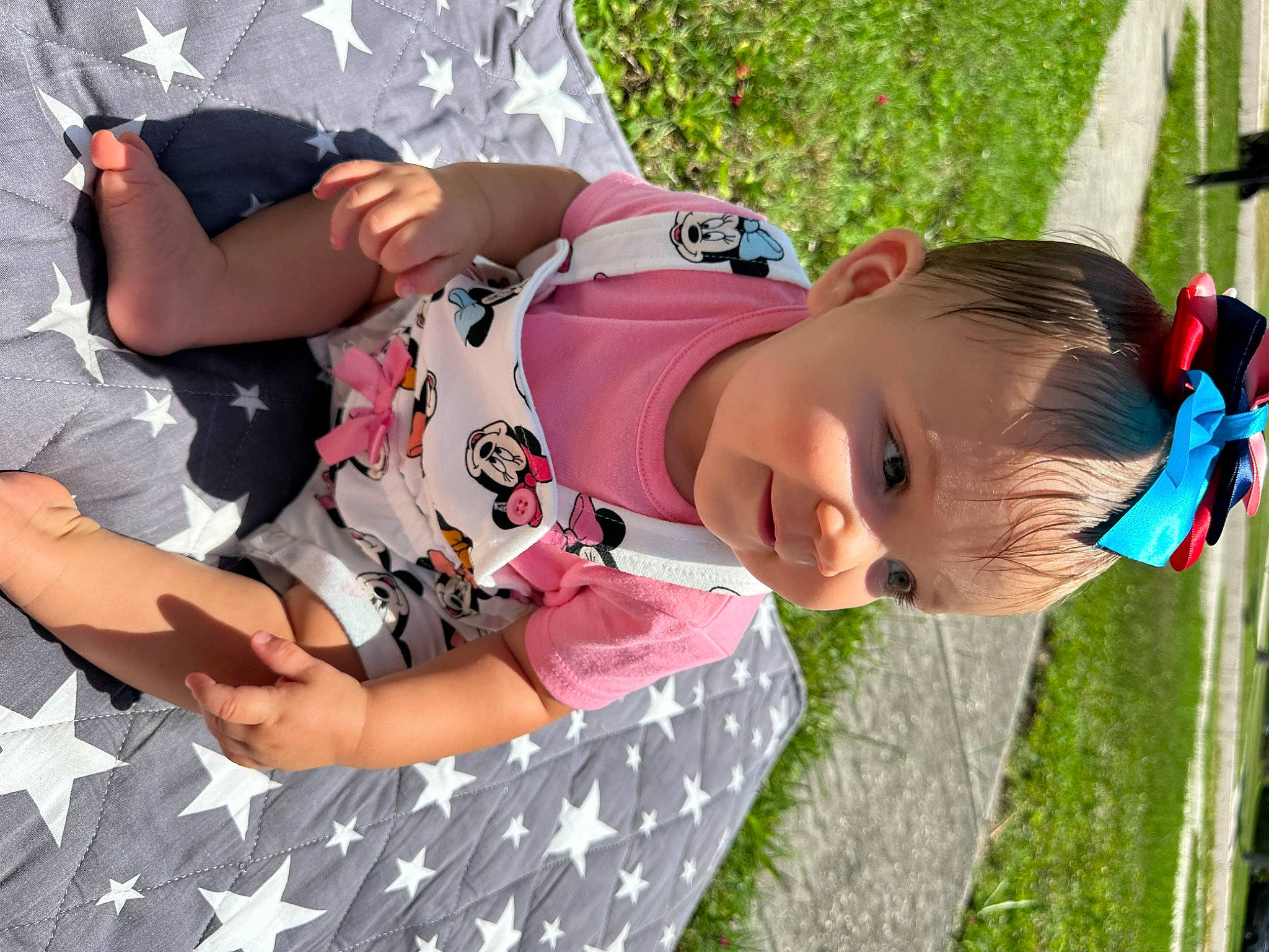 Saylor joined the competition — help win amazing prizes! baby, baby_toddler_clothing, child, comfort, fun, grass, green, happy, leaf, leisure, pattern, person, pink, plant, play, recreation, shorts, sitting, thigh, toddler