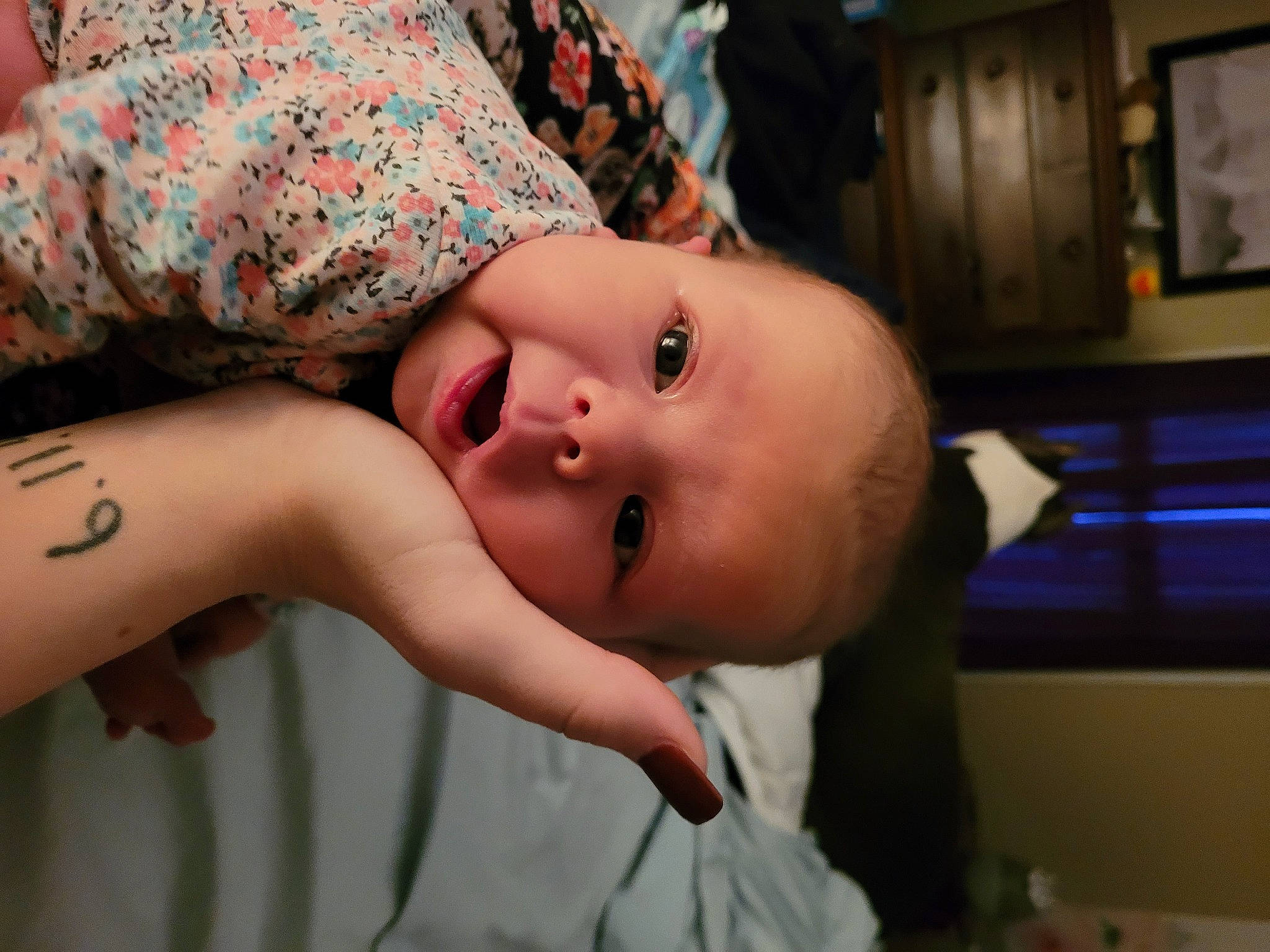 Vivian is registered to the contest to win money with this photo: arm, baby, chest, eye, eyebrow, eyelash, finger, glasses, hair, hat, head, human_body, lip, mouth, neck, nose, person, picture_frame, plant, skin