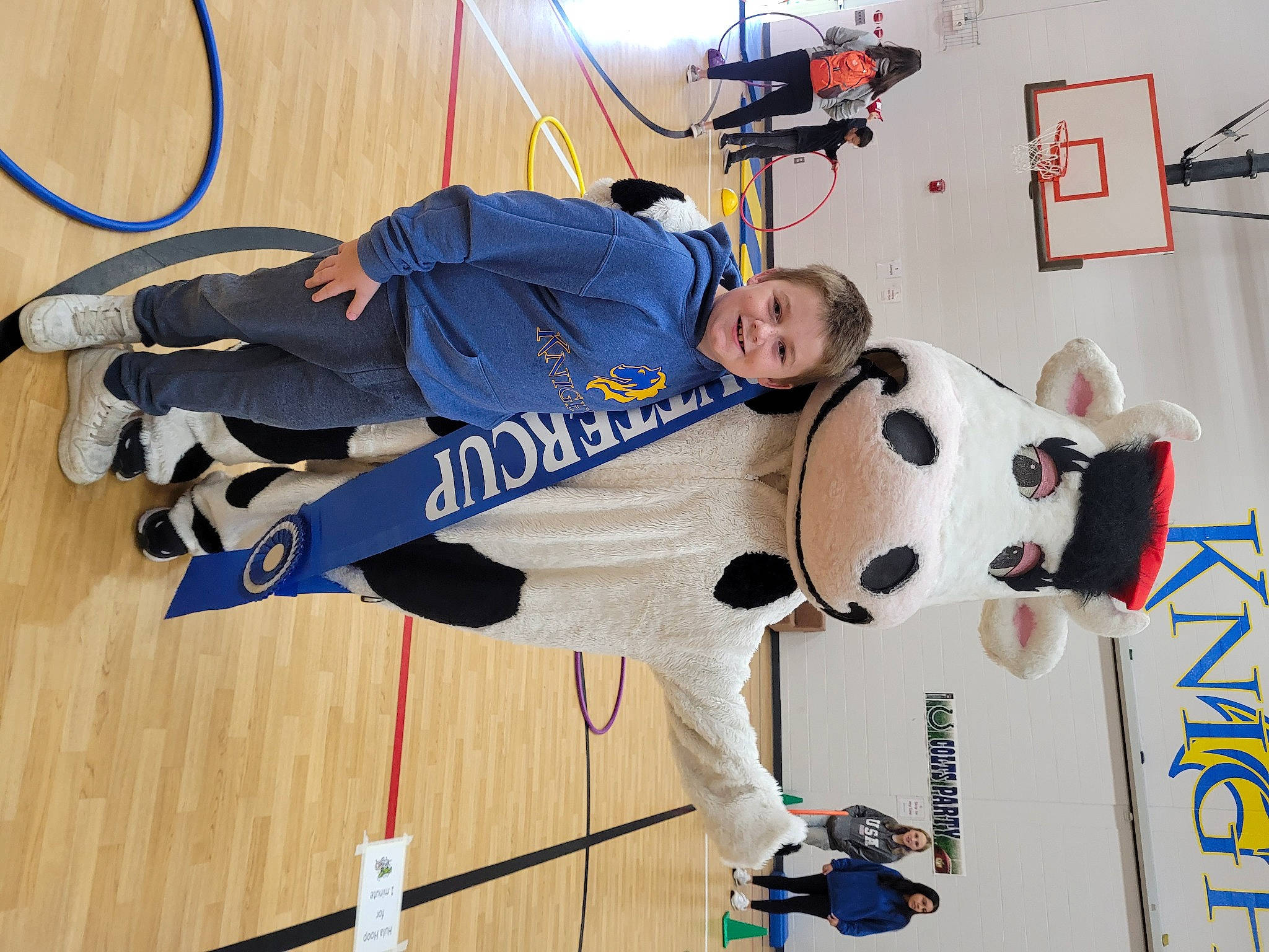 Blaze joined the competition — help win amazing prizes! basketball, flooring, hardwood, joy, knee, machine, person, recreation, room, smile, sports, sports_gear, sports_uniform, sportswear, uniform, wood, wood_flooring