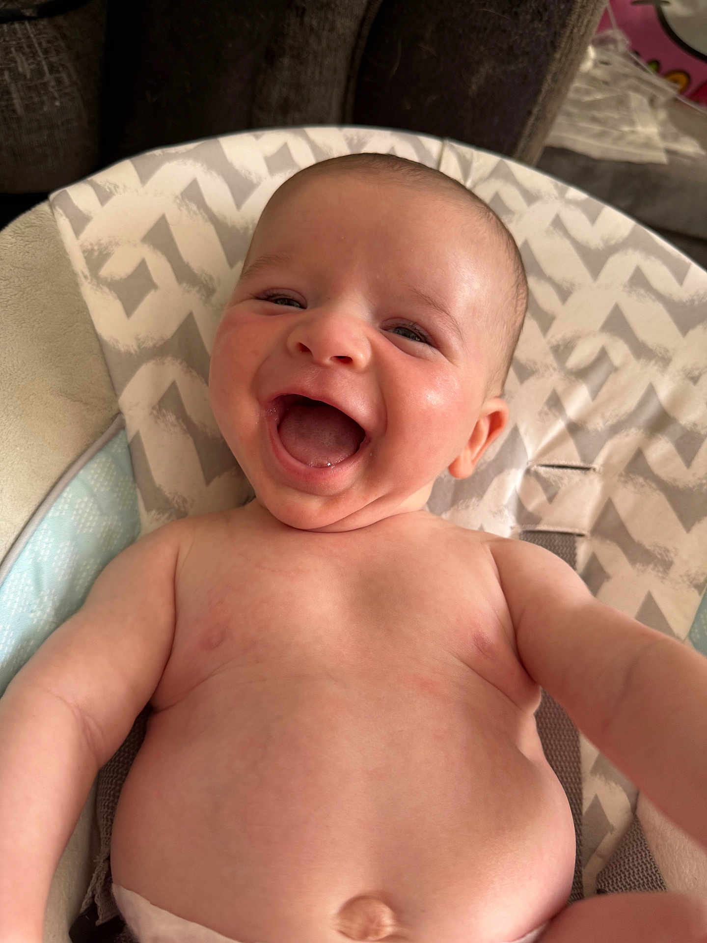 Leo joined the competition — help win amazing prizes! baby, smiling, infant, happy, face, skin, mouth_open, cheeks, lying_down, cushion, patterned_background, closeup, chubby, bare_chest, human, child, cute, expression, indoors, person