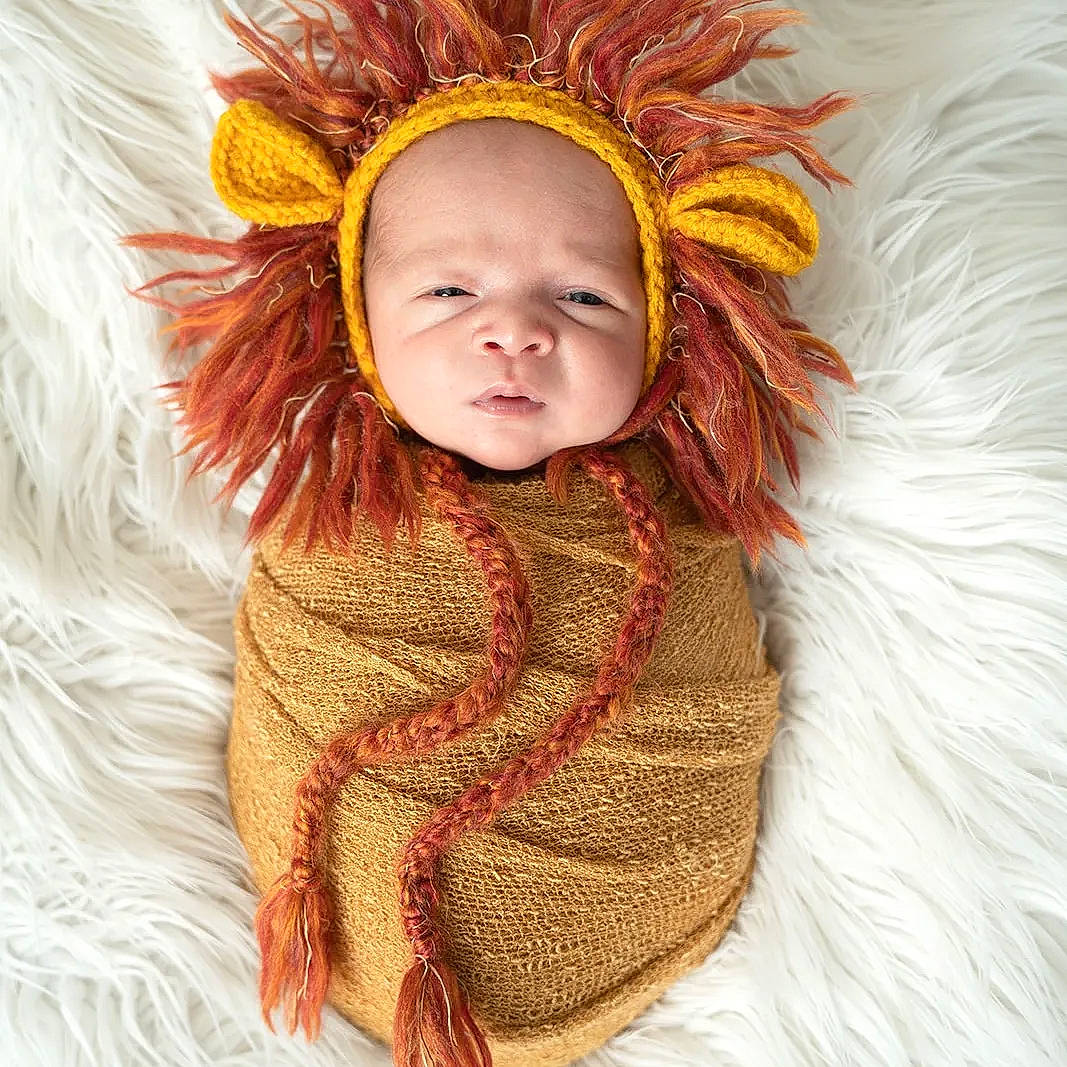 Cade is registered to the contest to win money with this photo: baby, baby_toddler_clothing, brown_hair, costume_hat, eye, eyelash, face, fashion_accessory, fashion_design, fur, fur_clothing, happy, headpiece, linens, peach, person, sleeve, stole, toddler, wool