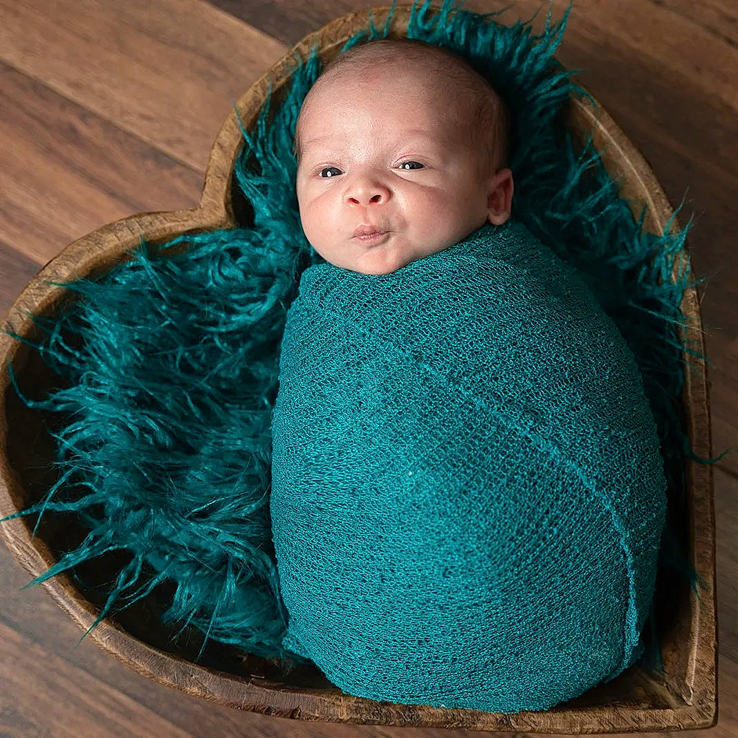 Cade joined the competition — help win amazing prizes! aqua, azure, baby, baby_products, baby_toddler_clothing, comfort, electric_blue, eye, face, grey, iris, outerwear, pattern, person, shawl, sleeve, textile, toddler, wood, wool