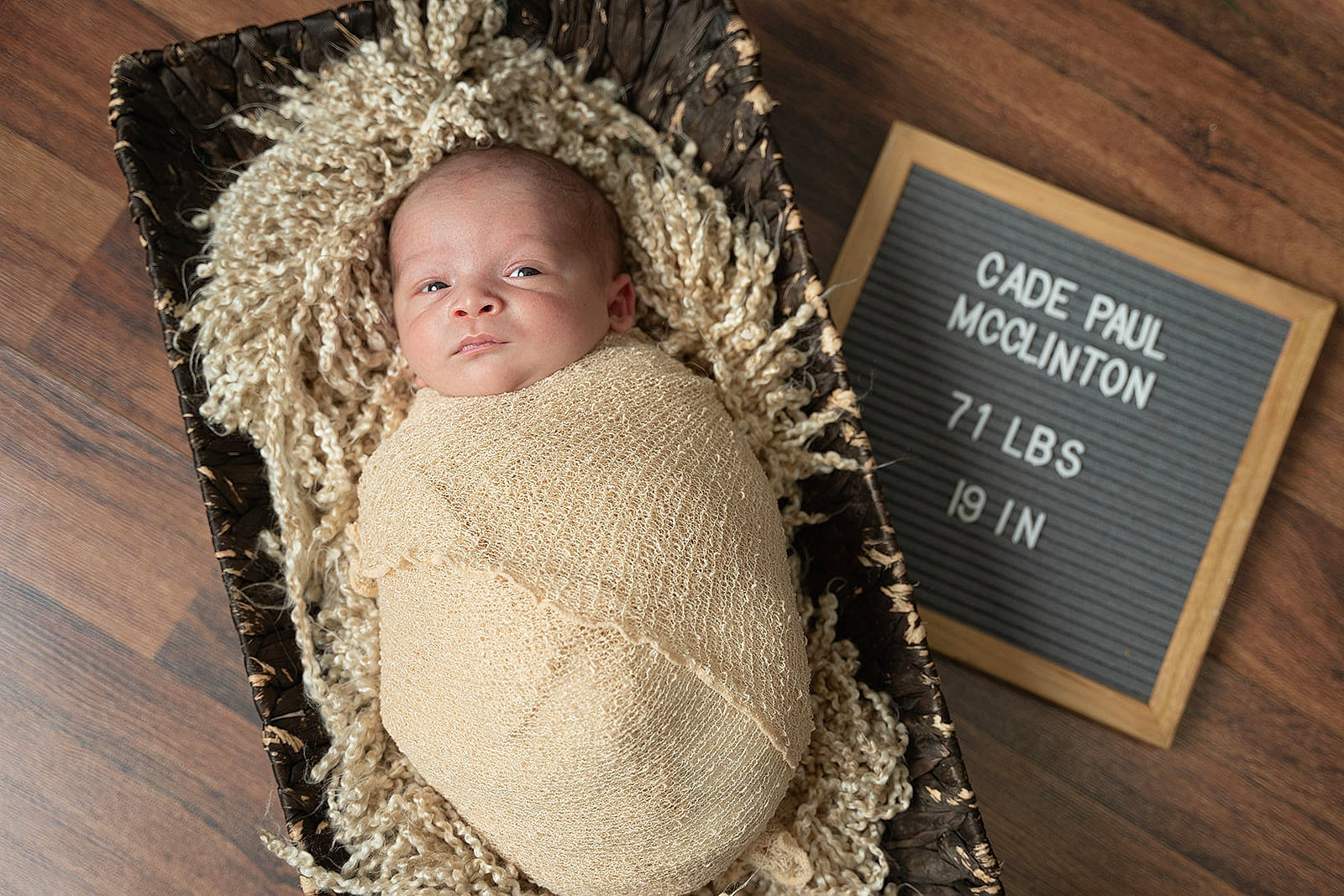 Cade joined the competition — help win amazing prizes! baby, baby_toddler_clothing, child, comfort, eye, fashion_accessory, font, fur, happy, headgear, linens, person, portrait_photography, publication, sitting, smile, toddler, twig, wicker, wood