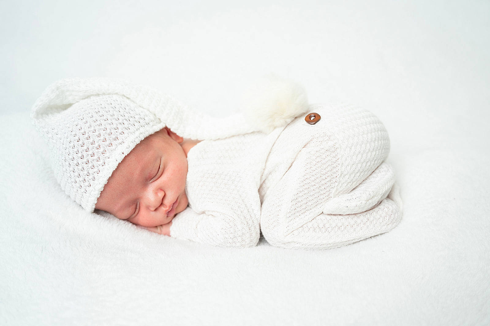 Cade is registered to the contest to win money with this photo: baby, baby_products, baby_safety, baby_sleeping, baby_toddler_clothing, beanie, bedding, bedtime, cap, comfort, fashion_accessory, grey, headgear, headwear, knit_cap, linens, nap, person, textile, toddler