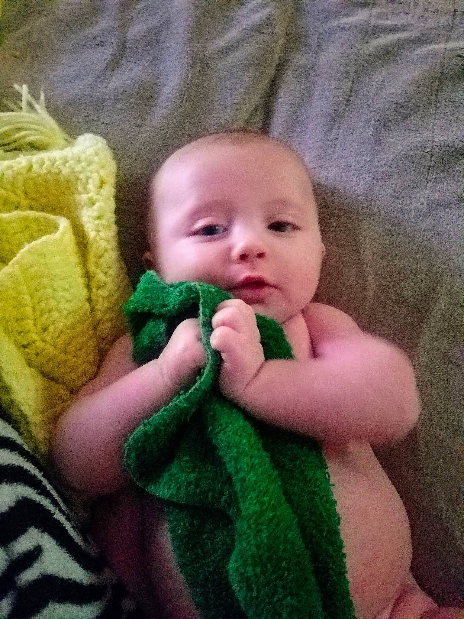 Bowie is registered to the contest to win money with this photo: cheek, child, crochet, eye, finger, girl, green, hand, infant, iris, knitting, lip, mouth, nose, person, product, skin, smile, toddler