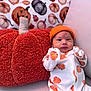 baby, infant, pumpkin, plush, pillow, hat, onesie, orange, white, cute, autumn, fall, decor, jack_o_lantern, face, person, cozy, background, sitting, indoors