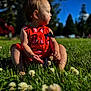 bodypart, child, face, female, field, finger, flower, girl, grass, grassland, hand, head, lawn, nature, outdoors, person, photography, plant, portrait, sitting