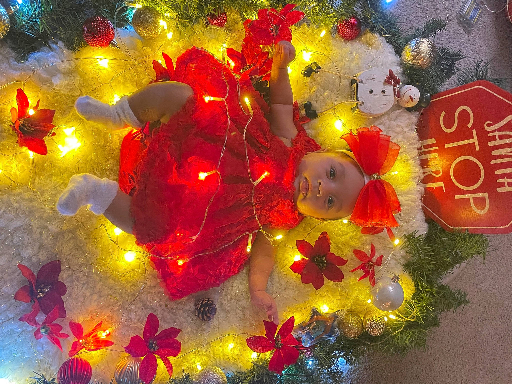 Lia is registered to the contest to win money with this photo: branch, celebrating, christmas, christmas_decoration, christmas_eve, christmas_lights, christmas_ornament, decoration, event, evergreen, gold, happy, headwear, holiday, holiday_ornament, interior_design, light, organism, ornament, person