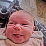 Joline participe au concours pour gagner de l'argent avec cette photo : baby, babylaughing, blanket, clothing, face, glove, happy, head, newborn, person, photography, portrait, quilt, smile, towel