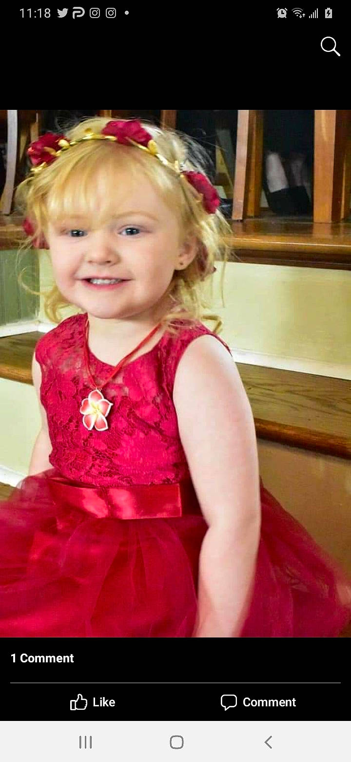 Saoirse is registered to the contest to win money with this photo: baby_toddler_clothing, cheek, dress, embellishment, eyebrow, face, fun, hair, hairstyle, happy, head, headpiece, iris, joy, long_hair, magenta, organ, person, pink, skin